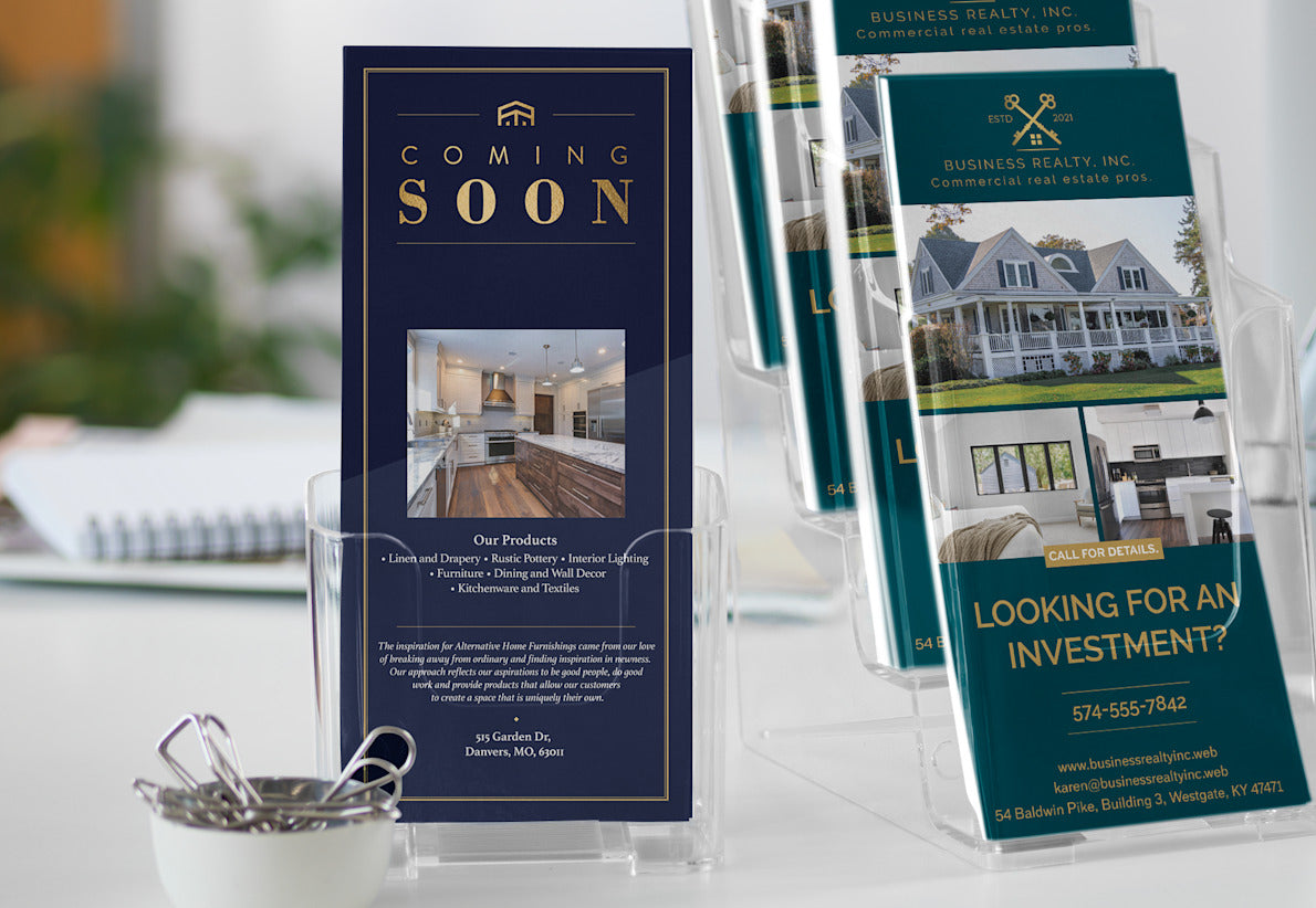 Real estate brochures on a table with a focus on 'Coming Soon' and investment opportunities.