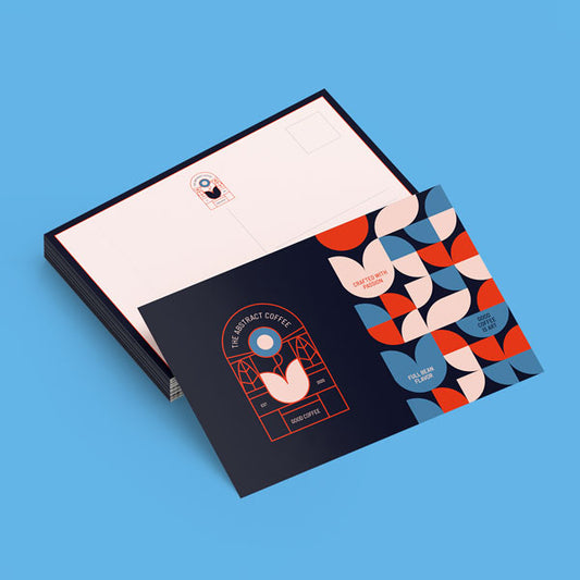 Stack of custom personal cards on a blue background