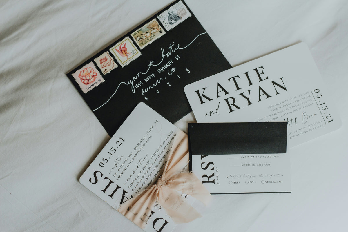 Wedding invitation set with RSVP card on a light background
